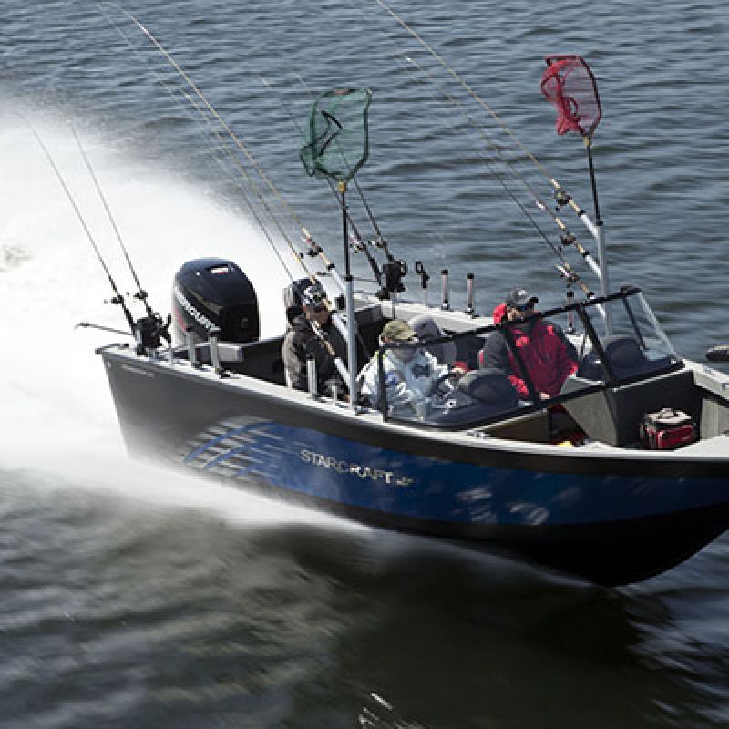 A blue fishing boat speeding on water, with three people, fishing rods, and nets.